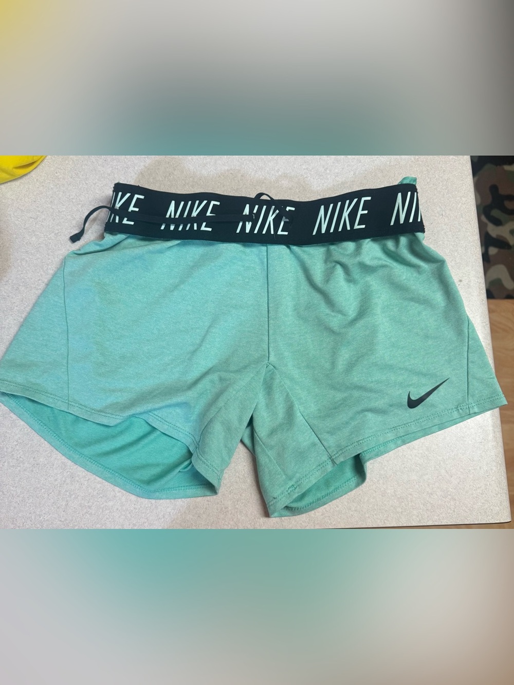 Nike Women’s Teal Athletic Shorts with Branded Waistband.